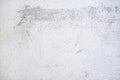 Plastered wall surface with rubbed off white paint, light gray background texture for urban themes or architecture, full frame, Royalty Free Stock Photo