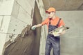 Plasterer applying plaster on block wall. Rennovation Royalty Free Stock Photo