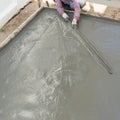 Plasterer concrete cement worker plastering flooring