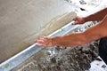 Plasterer concrete worker at floor work Royalty Free Stock Photo