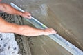 Plasterer concrete worker at floor work Royalty Free Stock Photo