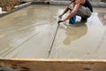 A plasterer concrete worker at floor work Royalty Free Stock Photo