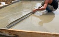 A plasterer concrete worker at floor work Royalty Free Stock Photo