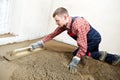 Plasterer concrete worker at floor work