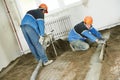 Plasterer concrete worker at floor work