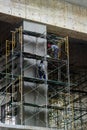 Plasterer concrete worker at wall