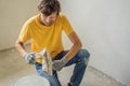 Plasterer home improvement handyman worker with putty knife working on apartment wall filling Royalty Free Stock Photo