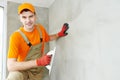 Plasterer at indoor ceiling work Royalty Free Stock Photo