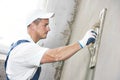 Plasterer at indoor wall renovation Royalty Free Stock Photo