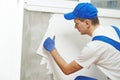 Plasterer at indoor wall work Royalty Free Stock Photo