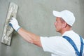 Plasterer at indoor wall work Royalty Free Stock Photo