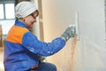 Plasterer at indoor wall work Royalty Free Stock Photo