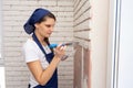 Plasterer plasters the wall, causing it to imitate brickwork