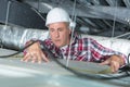 Plasterer putting insulation on ceiling