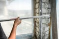 The plasterer repairs the corners of the window with a spatula and plaster. Construction finishing works
