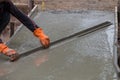 Plasterer screed concrete for floor Royalty Free Stock Photo