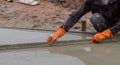 Plasterer screed concrete for floor Royalty Free Stock Photo