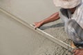Plasterer screed concrete for floor Royalty Free Stock Photo