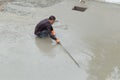 Plasterer screed concrete for floor Royalty Free Stock Photo