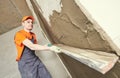 Plasterer putting plaster on wall. slow motion