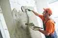 Plasterer putting plaster on wall. slow motion Royalty Free Stock Photo