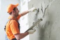 Plasterer putting plaster on wall. slow motion