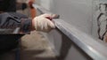 Plasterer at work on construction site, leveling walls and checking quality. Industrial worker on construction site. Worker Royalty Free Stock Photo