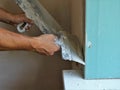 plasterer work with window slope and putty Royalty Free Stock Photo