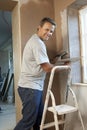 Plasterer Working On Interior Wall Royalty Free Stock Photo