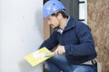 Plasterer working on interior wall Royalty Free Stock Photo