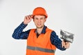 Plasterer in working uniform plastering tool putty knife, new home concept Royalty Free Stock Photo