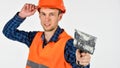 Plasterer in working uniform plastering tool putty knife, renovation concept Royalty Free Stock Photo