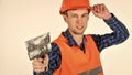 Plasterer in working uniform plastering tool putty knife, renovation concept Royalty Free Stock Photo