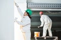 Plasterers at indoor wall work Royalty Free Stock Photo