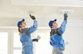 Plastererst at indoor ceiling work Royalty Free Stock Photo