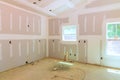 Plastering drywalling of a newly constructed house were completed prior to painting Royalty Free Stock Photo