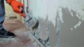 plastering a room wall with an elastic mortar Royalty Free Stock Photo