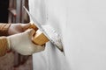 Plastering and smoothing wall Royalty Free Stock Photo