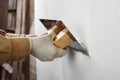 Plastering and smoothing wall Royalty Free Stock Photo