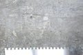 Plastering spatula or trowel for renovations on concrete wall cement background, copy space Royalty Free Stock Photo