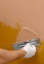 Plastering using a trowel