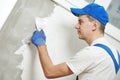 Plasterwork and wall painting preparation. craftsman applying plaster or filling