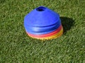 Plastic baffles on the grass of the soccer field Royalty Free Stock Photo