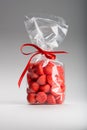 Plastic bag of acidulous strawberries isolated with elegant red Royalty Free Stock Photo