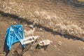 Plastic bag and bottles on the beach, seashore and water pollution concept. Royalty Free Stock Photo