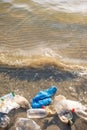 Plastic Bag And Bottles On The Beach, Seashore And Water Pollution Concept.