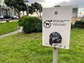 Plastic bag dispenser for collecting pet dog poop or excrement from the ground