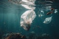 plastic bag floating in the middle of many fish, sea pollution problem for wildlife, underwater view ocean contamination, Royalty Free Stock Photo