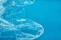 Plastic bag floating on surface of blue water, top view. Royalty Free Stock Photo