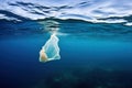 plastic bag floating on the surface of the ocean Royalty Free Stock Photo